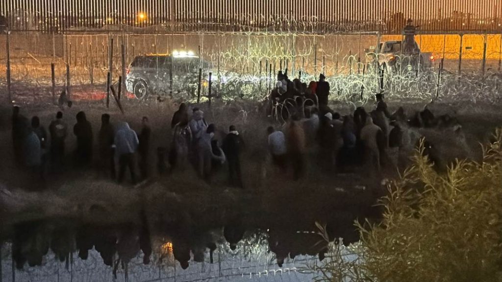 migrantes en alambrada